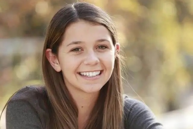 teen girl smiling brunette contacts ortho k